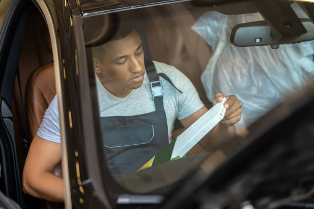 mechanic inside car