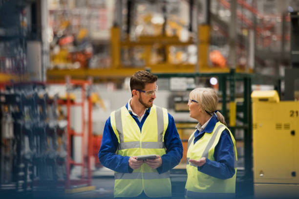 Two people talking in warehouse
